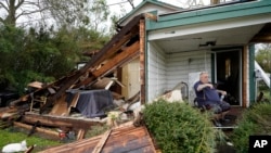 Chris Johnson views destruction at his home on Thursday, Aug. 27, 2020, in Lake Charles, La., after Hurricane Laura moved through the state. Johnson stayed in his home as the storm passed. (AP Photo/Gerald Herbert)