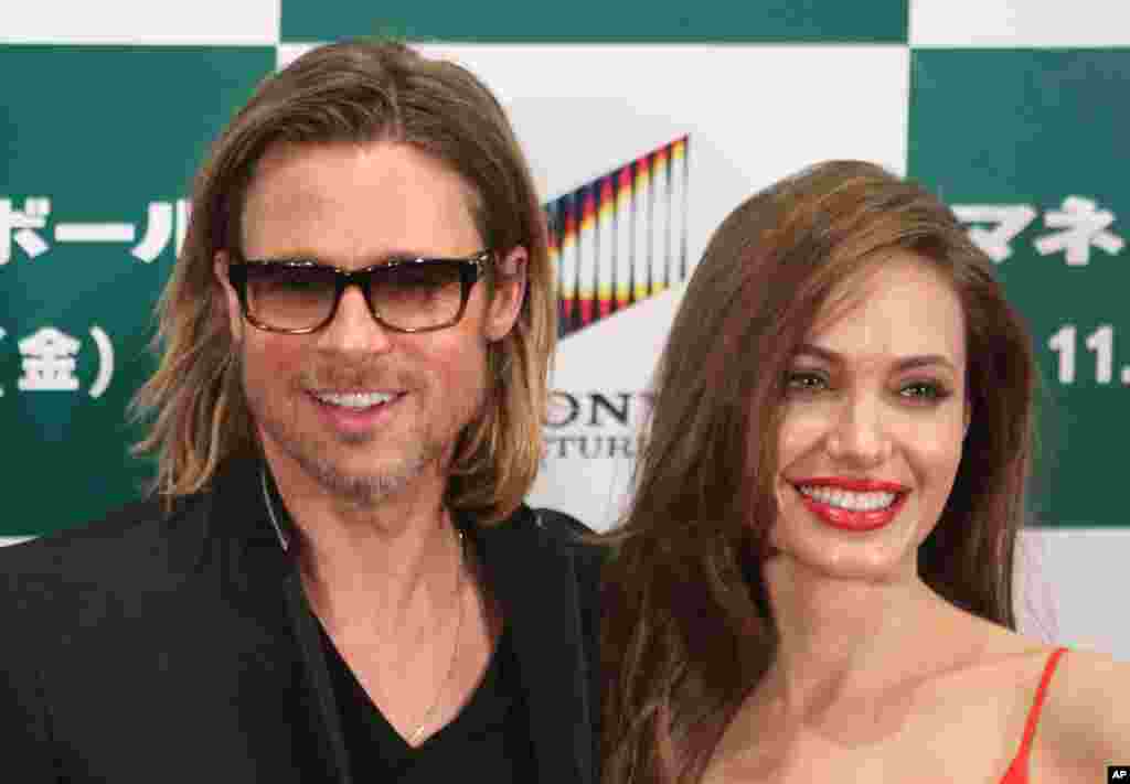 Brad Pitt was nominated for Best Actor for his work in the film "Moneyball," also nominated for Best Picture. He and Angelina Jolie are pictured at the Japan premiere of Moneyball Nov. 9, 2011. (AP)