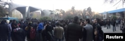 People protest near the university of Tehran, Iran, Dec. 30, 2017 in this picture obtained from social media.