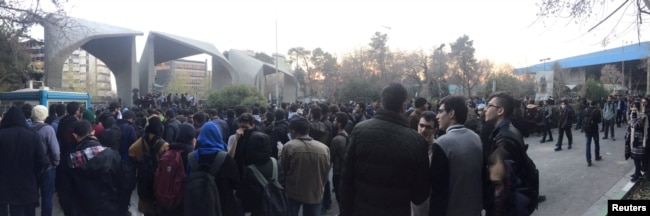People protest near the university of Tehran, Iran, Dec. 30, 2017 in this picture obtained from social media.