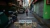 A makeshift barricade blocks a street from outsiders to protect a neighborhood from the spread of coronavirus disease in Manila, Philippines, March 23, 2020. 