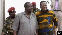 General Antonio Indjai, Army Chief of Staff, center, with Desejado Lima da Costa, head of the national electoral commission, right, Guinea-Bissau, March 19, 2012.