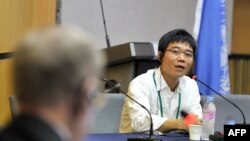 FILE - Ji Seong-ho, a North Korean defector, speaks as Michael Kirby, left, chairman of the U.N. Commission of Inquiry on Human Rights in North Korea, listens during a public hearing at Yonsei University in Seoul, Aug. 22, 2013. 