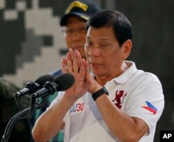 Philippine President Rodrigo Duterte gestures while addressing the Philippine Army Scout Rangers during his visit to their headquarters at Camp Tecson in San Miguel township, north of Manila, Philippines, Sept. 15, 2016.