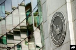 FILE - The U.S. Securities and Exchange Commission building is seen, in Washington, June 19, 2015.