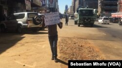 One demonstrator held a placard addressed to the electoral commission chairperson, Rita Makarau, July 12, 2017. The sign said, “Makarau, we demand a fair election 2018!!” Police descended on the protester and forced him into their vehicle. 