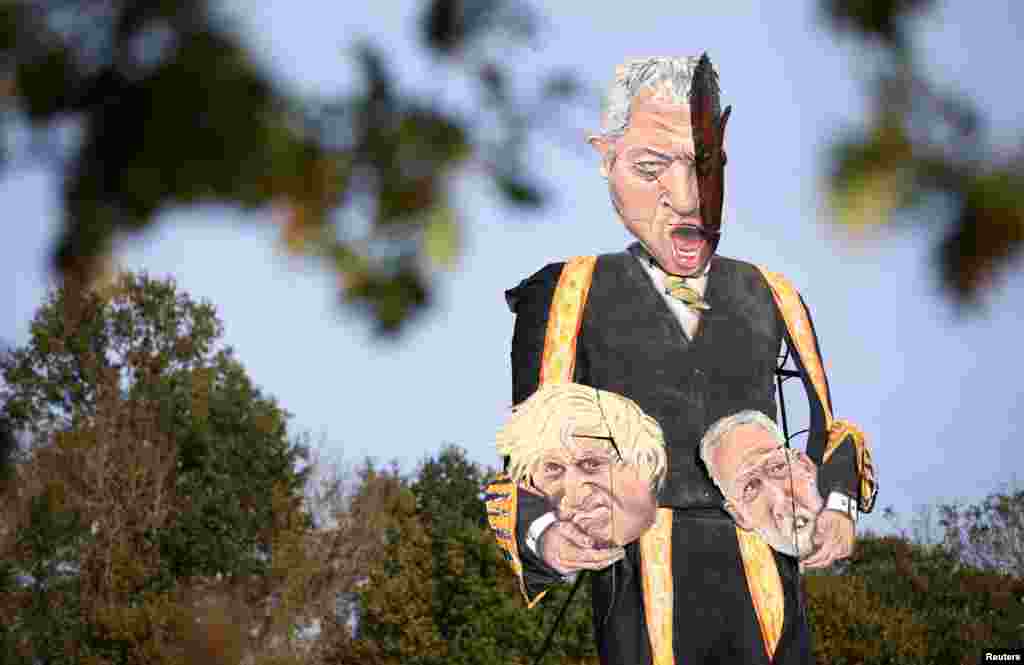 The 11-meter model of Britain&#39;s Speaker of the House of Commons John Bercow holding the heads of Prime Minister Boris Johnson and Labour Party leader Jeremy Corbyn is shown in Edenbridge, Britain.