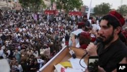 FILE - In this April 22, 2018, file photo, Manzoor Pashteen, a leader of Pashtun Tahafuz (Protection) Movement or (PTM) addresses his supporters during a rally in Lahore, Pakistan.