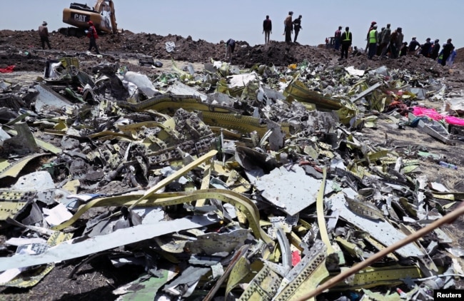 FILE - Wreckage is seen at the site of the Ethiopian Airlines plane crash, southeast of Addis Ababa, Ethiopia, March 11, 2019.