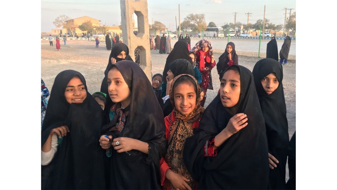 FILE - Afghan refugee girls gather at the Bardsir settlement for Afghan refugees in Kerman province, Iran, Oct. 22, 2016.