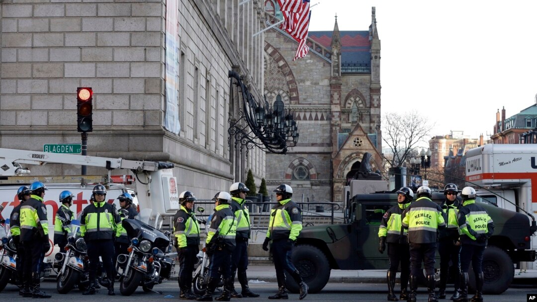 Boston police officers keep a perimeter secure in Boston's Copley Square as an investigation continues into the bomb blasts at the finish area of the Boston Marathon which killed 3 and injured over 140 people, April 16, 2013.
