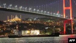 Palau-flagged Resilient Africa vessel sails along the Bosphorus Strait past Istanbul on September 21, 2023, with the Sultanahmet Mosque (L) in the background.