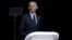 Former U.S. President Barack Obama, left, delivers his speech at the 16th Annual Nelson Mandela Lecture at the Wanderers Stadium in Johannesburg, South Africa, July 17, 2018.