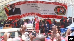 Zimbabwean Movement for Democratic Change supporters gather to pay their last respects during the burial of former leader Morgan Tsvangirai in Buhera, Zimbabwe, about 200 kilometers southeast of Harare, Feb. 20, 2018.