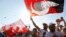 People wave Turkish flags during a rally to mark the end of the main opposition Republican People's Party (CHP) leader Kemal Kilicdaroglu's 25-day long protest, dubbed "Justice March," against the detention of the party's lawmaker Enis Berberoglu, in Istanbul, Turkey July 9, 2017.