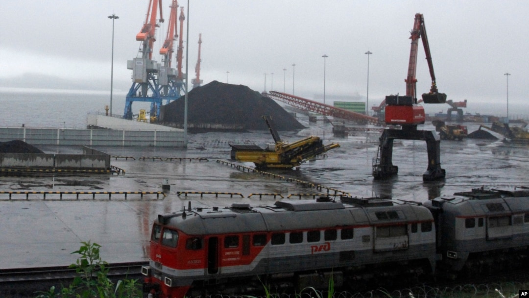 FILE - Coal brought from Siberia can be seen awaiting loading onto a ship bound for China in the North Korean special economic zone of Rason. The Liaoning Hongxiang Group allegedly sold North Korea aluminum bars and chemicals that have potential military purposes.