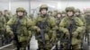 FILE - In this handout photo taken from video released by Russian Defense Ministry Press Service, Russian recruiters stand prior to their military training at the Patriot Park outside in Moscow, Russia, Saturday, Oct. 1, 2022. 