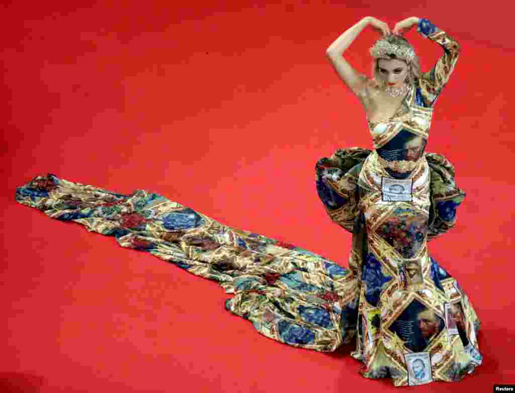 A model poses during the screening of the film &quot;BAC Nord&quot; during the 74th Cannes Film Festival in Cannes, France, July 12, 2021.