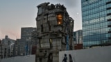 This photo taken on Nov. 13, 2024 shows pedestrians walking past the four-storey Arimaston Building by Japanese architect Keisuke Oka in the Mita area of Minato Ward in Tokyo. 