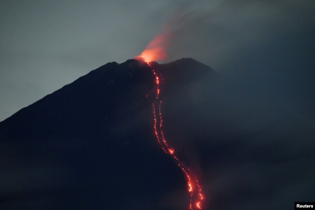 In this file photo, Mount Semeru volcano spews hot lava as it erupts, as seen from Oro-oro Ombo village in Lumajang, East Java province, Indonesia, January 17, 2021. (Zabur Karuru/Antara Foto via REUTERS)