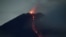 FILE - Mount Semeru volcano spews hot lava as it erupts, as seen from Oro-oro Ombo village in Lumajang, East Java province, Indonesia, January 17, 2021.