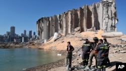 A rescue team surveys the site of this week's massive explosion in the port of Beirut, Lebanon, Aug. 7, 2020. 