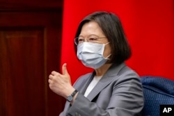 FILE - Taiwan's President Tsai Ing-wen gestures at the presidential office in Taipei, Aug. 22, 2022.