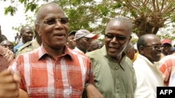 FILE: Senegalese opposition leaders, from left, Abdoulaye Bathily of the Democratic League/Movement for the Labor Party, Ousmane Tanor Dieng of the Socialist Party of Senegal and Madior Diouf of the National Democratic Gathering, march April 3, 2010, in Dakar, Senegal.