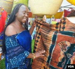 Monica Mensah showed off beautiful batik fabric from her home country of Ghana. (Deborah Block/VOA)