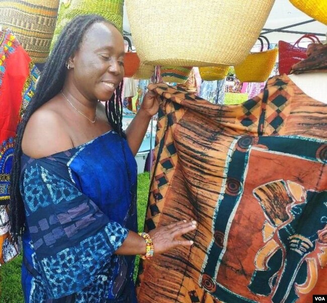 Monica Mensah showed off beautiful batik fabric from her home country of Ghana. (Deborah Block/VOA)