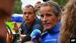 FILE - Director General of the International Atomic Energy Agency (IAEA) Rafael Mariano Grossi speaks to the media before a visit the Zaporizhzhia nuclear power plant, in Zaporizhzhia, Ukraine, Sept. 1, 2022.