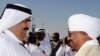 Qatari Emir Hamad bin Khalifa al-Thani (L) welcomes Sudanese President Omar al-Beshir upon his arrival in Doha to sign a peace deal between Khartoum and the Darfur rebel Justice and Equality Movement, 22 Feb 2010