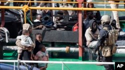 Armed forces stand aboard the Turkish oil tanker El Hiblu 1, which was hijacked by migrants, in Valletta, Malta, March 28, 2019.