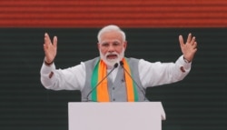 FILE - Indian Prime Minister Narendra Modi gestures as he speaks after releasing India's ruling Bharatiya Janata Party (BJP)'s election manifesto for the April/May general election, in New Delhi, April 8, 2019.