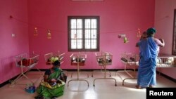 FILE - Nurses tend to newborn baby girls at the Life Line Trust orphanage in Salem in the southern Indian state of Tamil Nadu, June 20, 2013.
