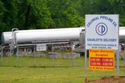 Tanker trucks are parked near the entrance of Colonial Pipeline Company, in Charlotte, N.C., May 12, 2021.