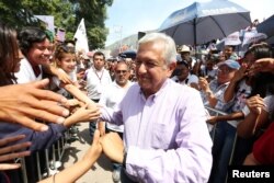 Leftist front-runner Andres Manuel Lopez Obrador of the National Regeneration Movement (MORENA) is greeted by supporters after a campaign rally in Tlapa de Comonfort, in Guerrero state, Mexico, June 7, 2018.