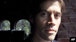 FILE - James Foley, pictured in May 2011, was one of 61 journalists killed last year, according to data from the Committee to Protect Jourmalists.