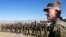 FILE - U.S. Army General John Nicholson, commander of Resolute Support forces and U.S. forces in Afghanistan, speaks with Afghan police special forces after they took part in a military exercise in Logar province, Afghanistan, Nov. 30, 2017.