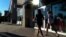 Shoppers walk by stores amid higher consumer confidence this month, which jumped to the highest level since February, in Methuen, Massachusetts, September 24, 2012.