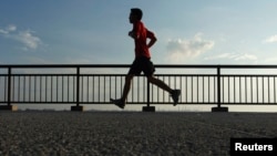 A man jogs at Labrador Park in Singapore in this August 29, 2013, file photo.