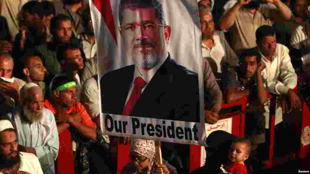 Morsi supporters are seen at a protest at Cairo's Rabaa al-Adawiya Square, the focal point of their sit-in, July 27, 2013.