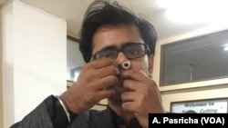 Prateek Sharma heads the New Delhi startup that produces the nose filters. He says they guard against air pollution and are comfortable to wear in the nose. (A. Pasricha/VOA, India, Jan 2018)