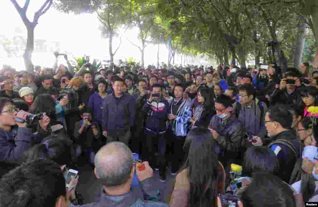 Demonstrators gather along a street near the headquarters of Southern Weekly newspaper, January 7, 2013. 