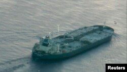 A still image from video taken by a U.S. Coast Guard HC-144 Ocean Sentry aircraft shows the oil tanker Union Kalavryta, which is carrying a cargo of Kurdish crude oil, approaching Galveston, Texas, July 25, 2014.