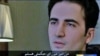 تصویر امیر میرزایی حکمکتی که مدتی پس از دستگیری در تلویزیون دولتی ایران پخش شد.