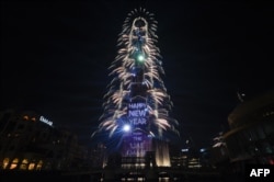Fireworks explode at the Burj Khalifah, said to be the world’s tallest building, on New Year's Eve to welcome 2019 in Dubai, United Arab Emirates, Dec. 31, 2018.