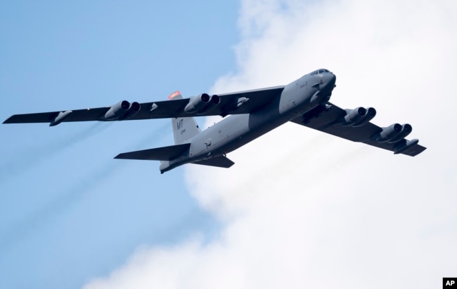 FILE - A U.S. Air Force B-52 strategic bomber flies over Pabrade during a military exercise north of Vilnius, Lithuania, June 16, 2016.