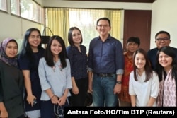 Former Jakarta Gov. Basuki "Ahok" Tjahaja Purnama poses with his relatives after being released from prison in Jakarta, Indonesia, Jan. 24, 2019.