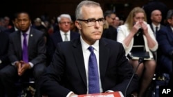 Acting FBI Director Andrew McCabe sits with a folder marked "Secret" in front of him while testifying on Capitol Hill in Washington, May 11, 2017.